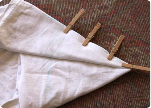 Use clothes pins to hold the fold