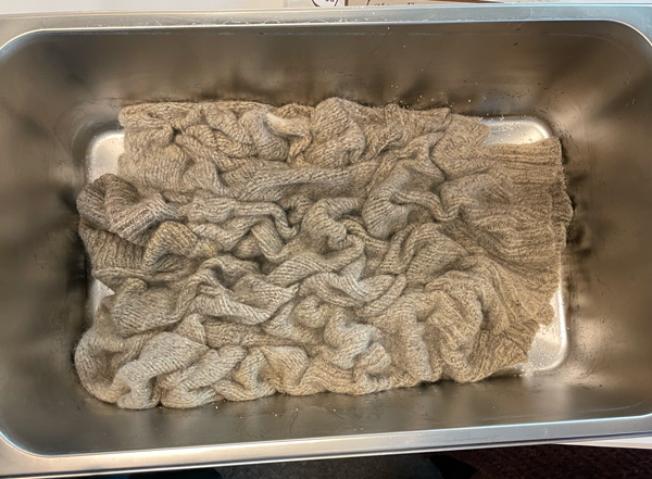 Arranged sweater in pan