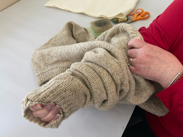 Attaching wool felt with felting needle